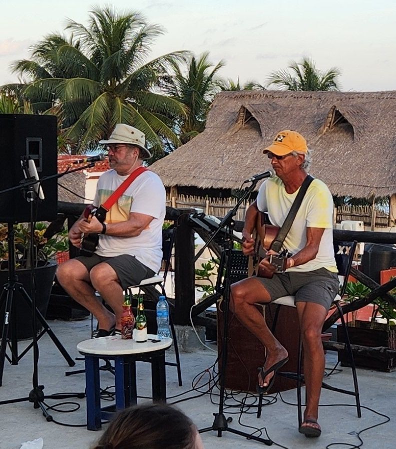 Randy's musician friends, John and Gary, playing their acoustic guitars during the winter tour down South.