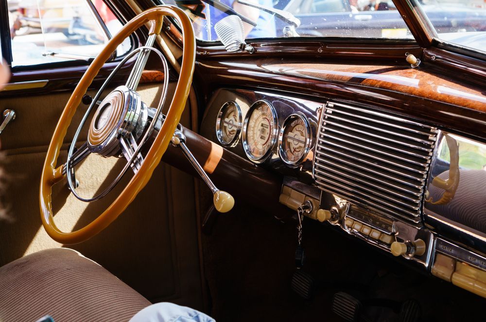 Interior Of A Classic Car With Wooden Steering Wheel — KND Autos in Berrimah, NT