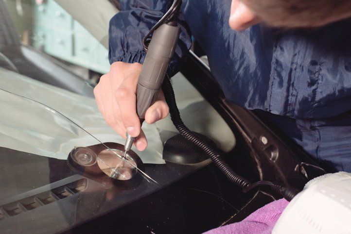 Worker Fixing and Repairing a Windshield — A1 Windscreens in Taminda, NSW