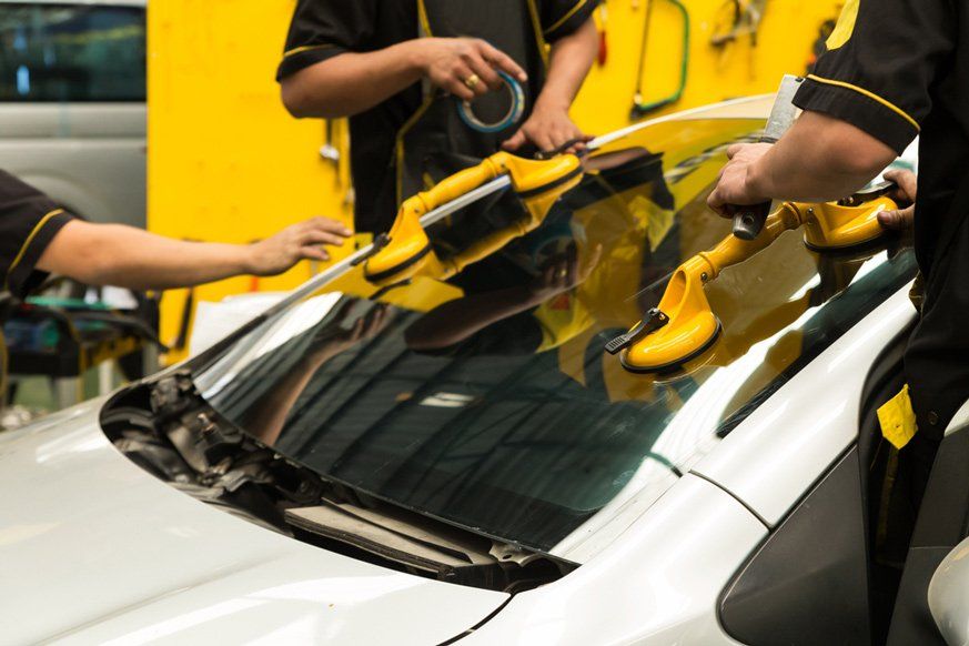 Workers Repairing Windshield — A1 Windscreens in Taminda, NSW