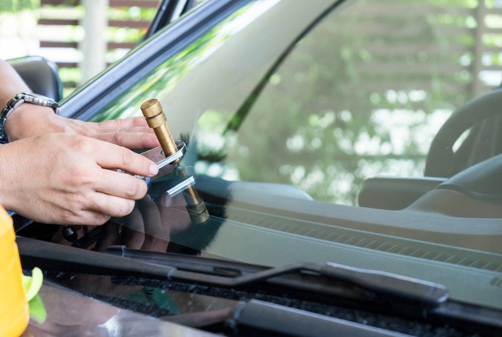 Man Using Tool to Repair Crack Windshield - Windscreen Repair in Tamworth, NSW