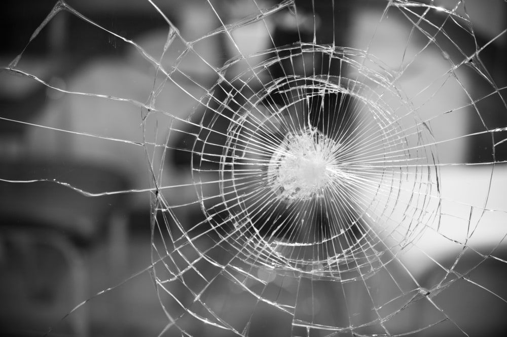 A Black and White Photo of A Broken Glass Window — A1 Windscreens in Quirindi, NSW
