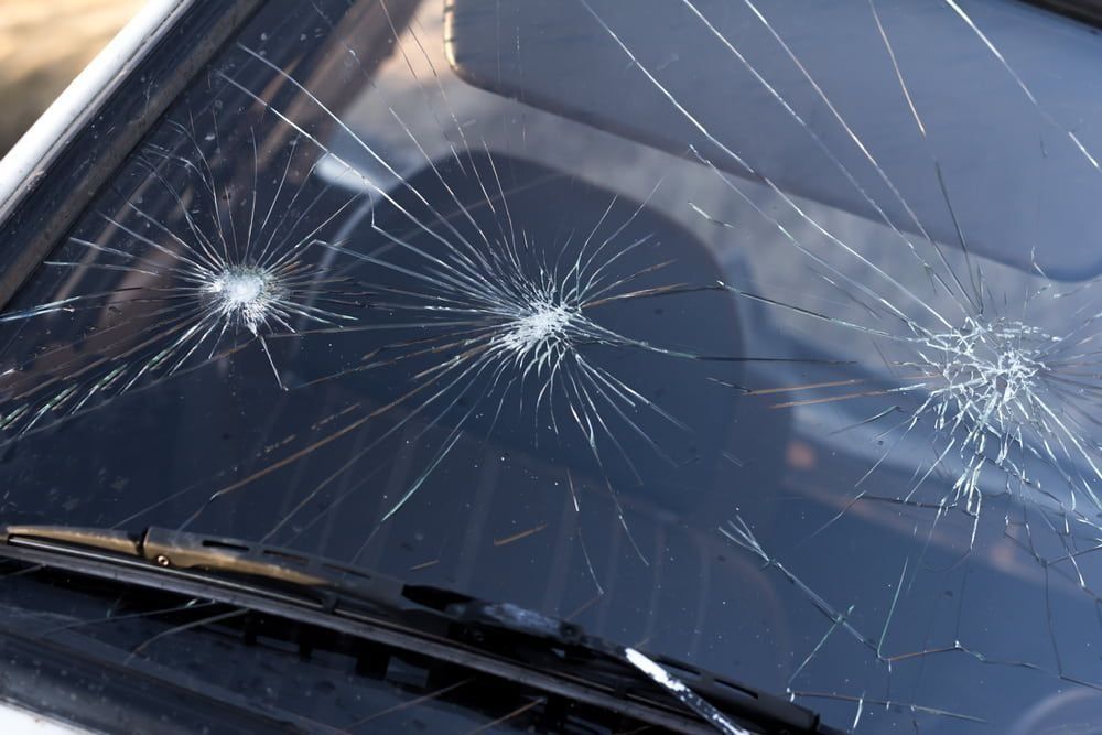 Car Windshield With Three Big Cracks