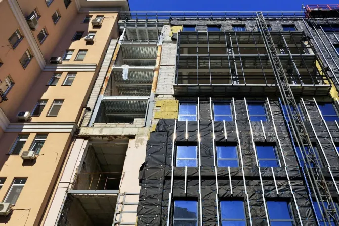 A building under construction with a lot of windows