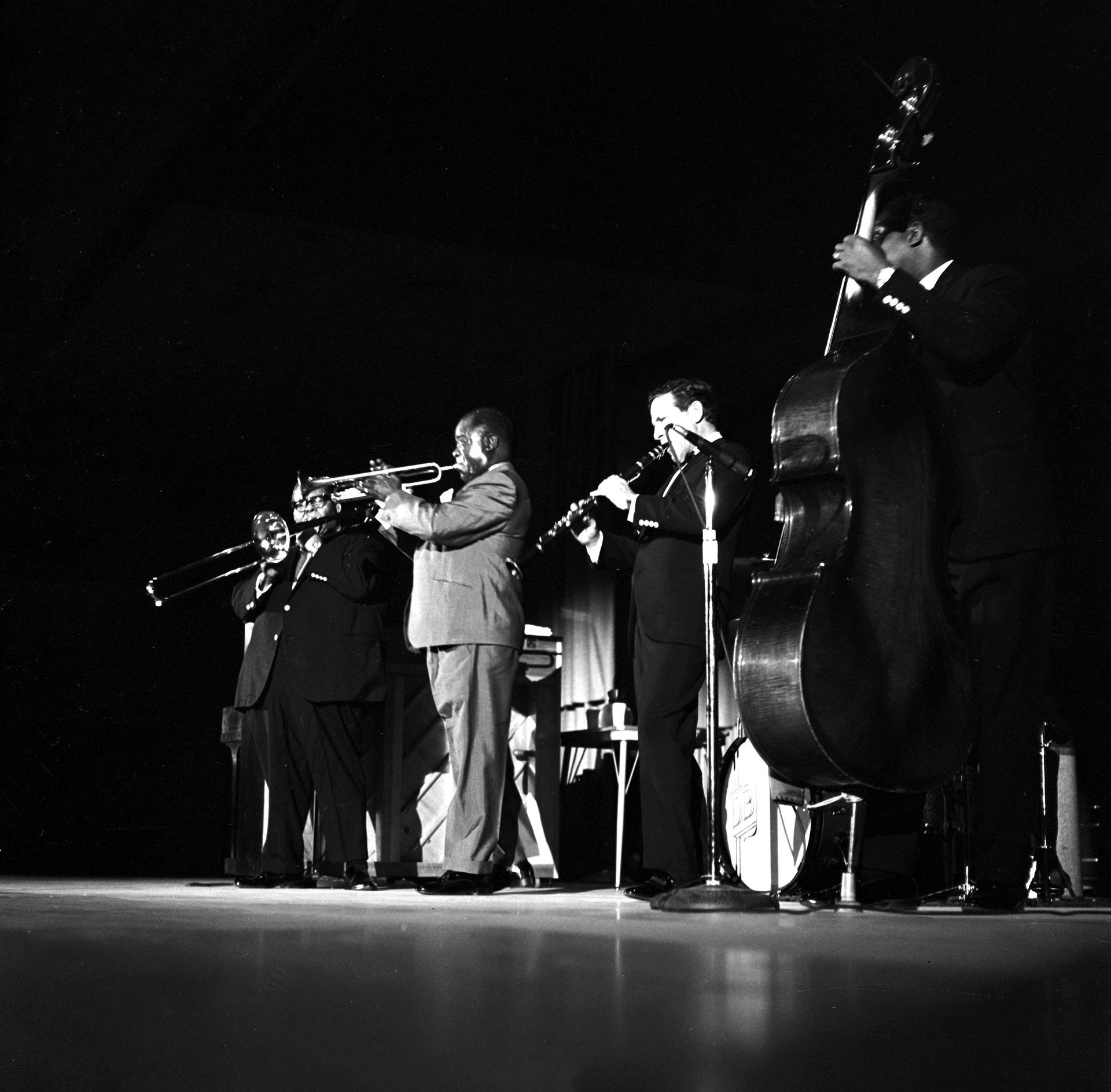 A black and white photo of a band playing instruments