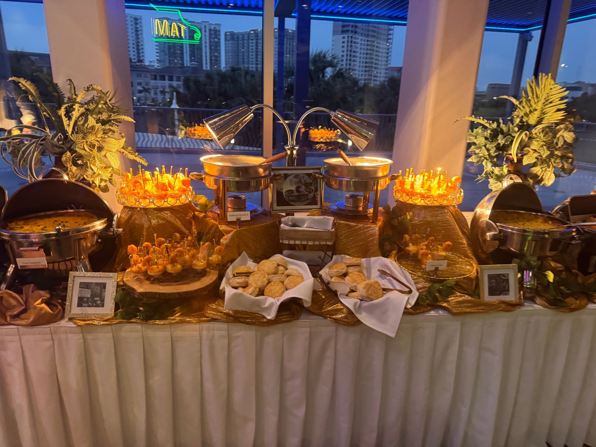 A buffet table with a lot of food on it.