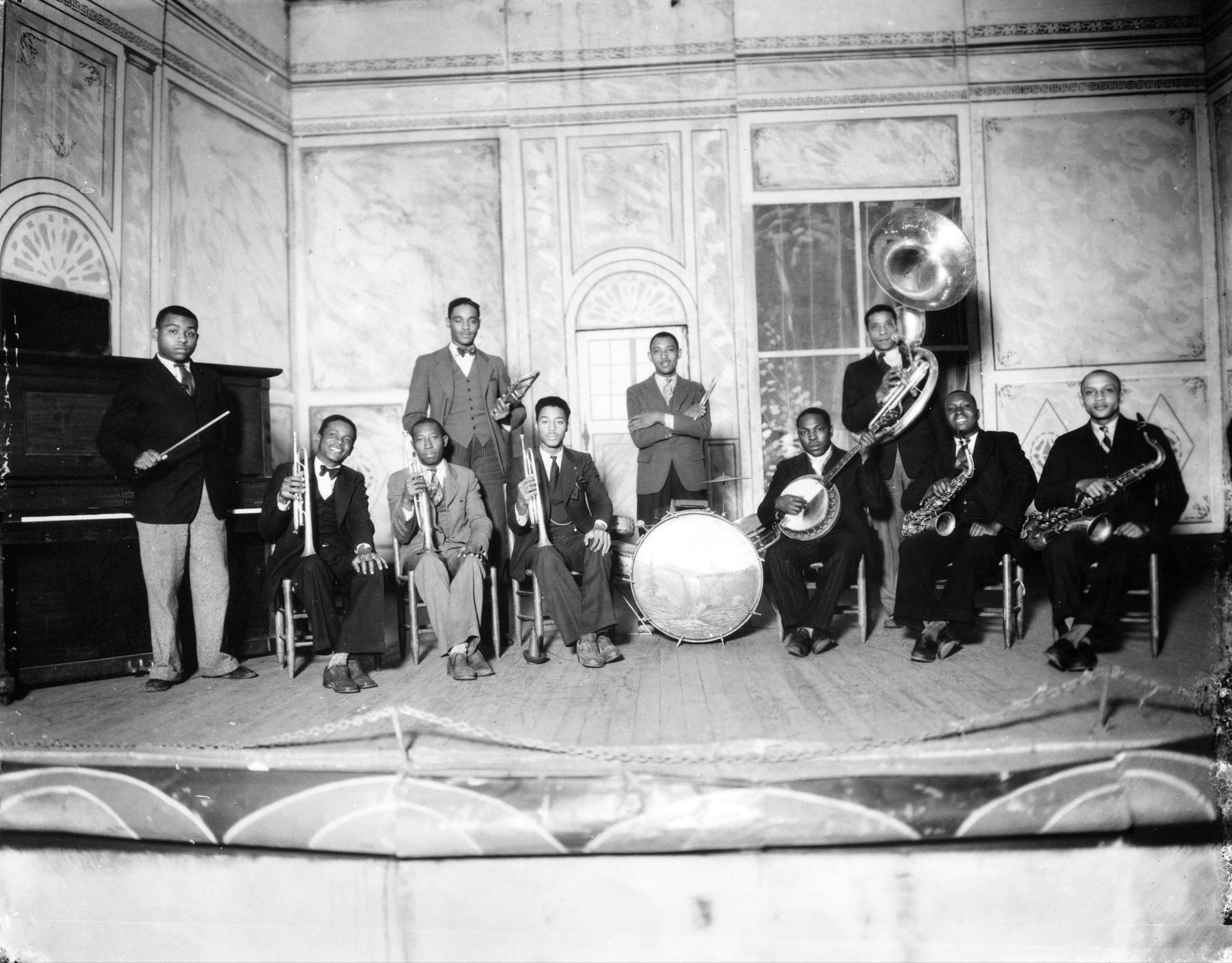 A black and white photo of a band playing instruments