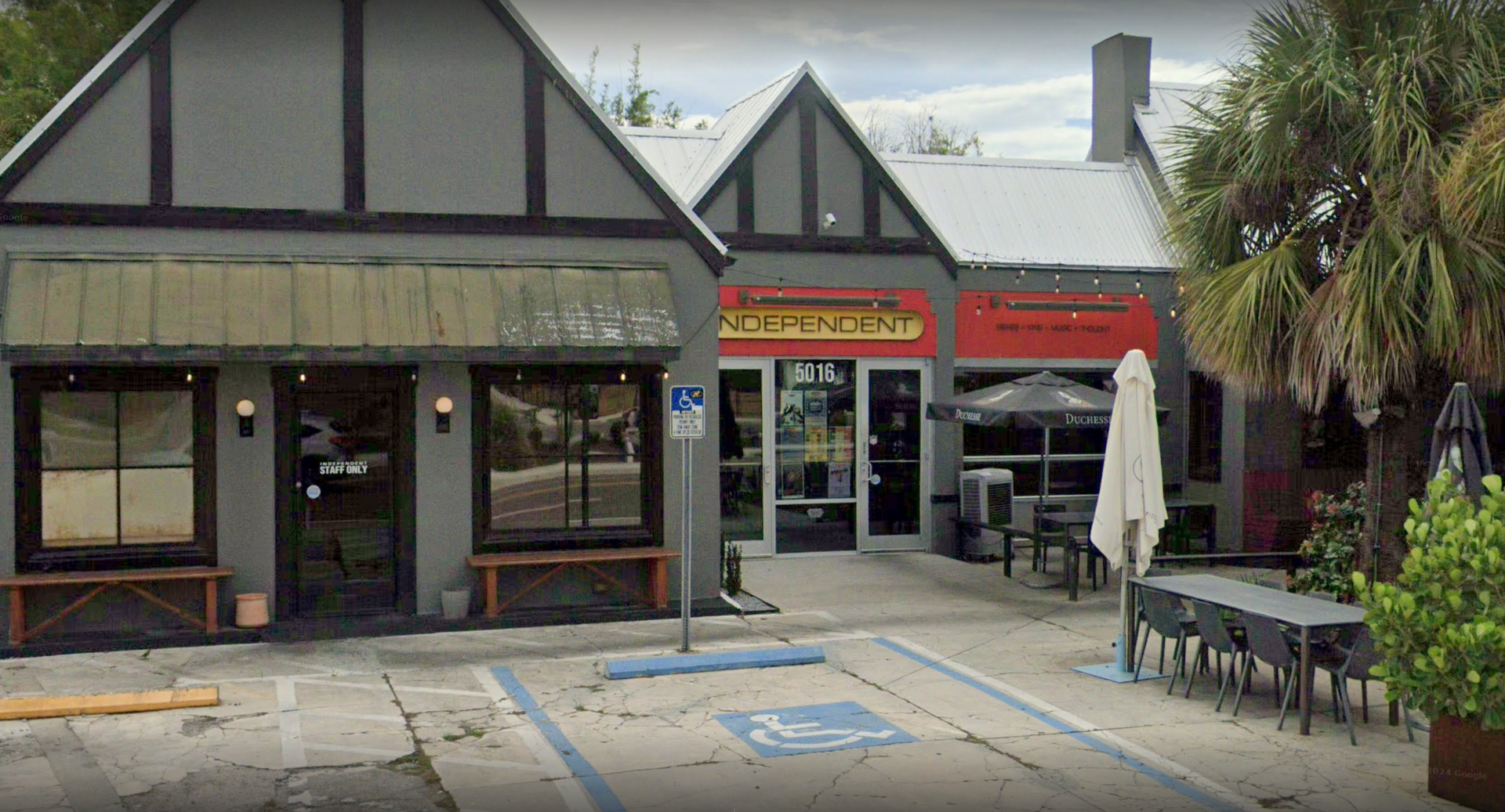 A restaurant with a handicapped parking spot in front of it.
