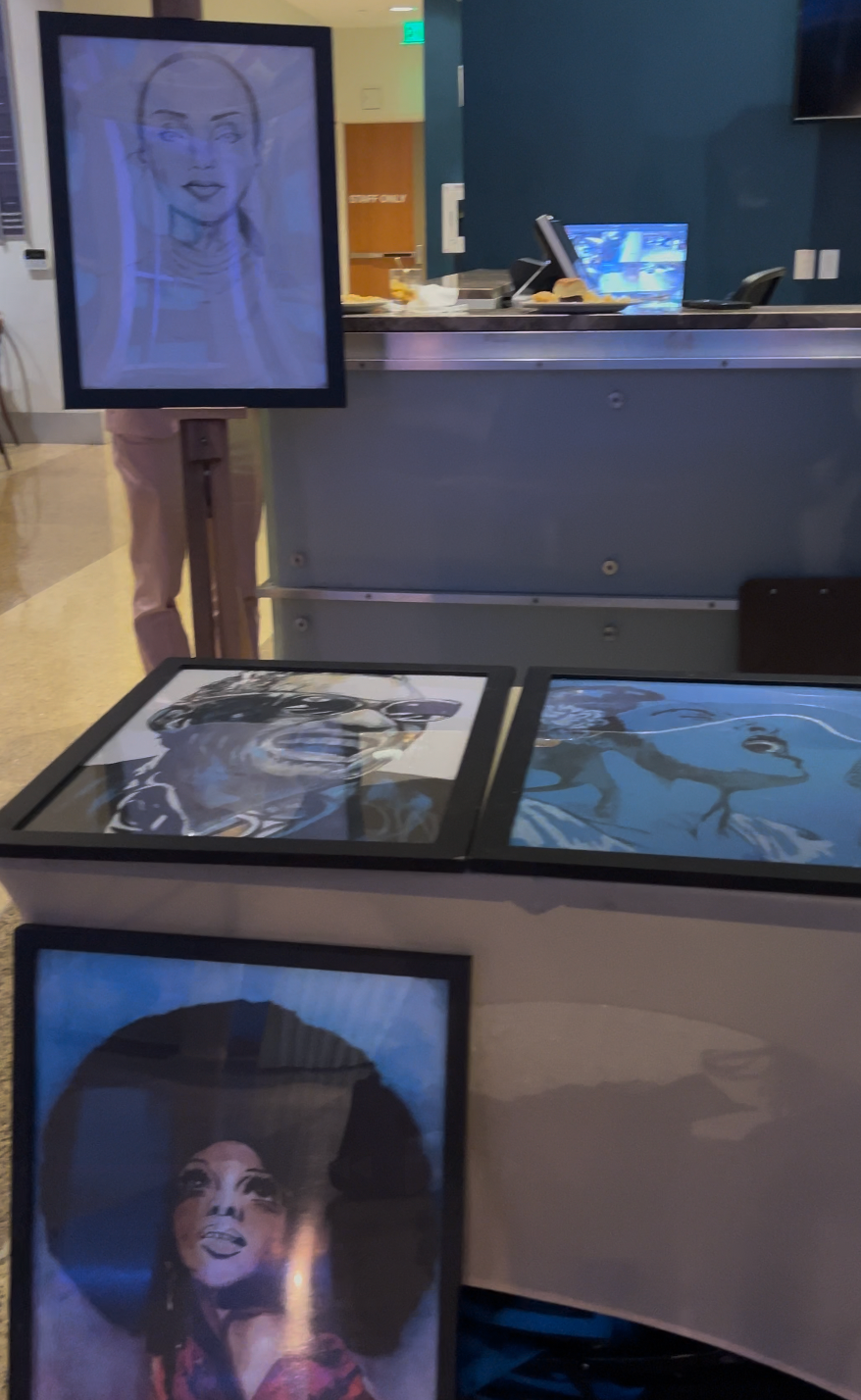 A table with pictures of a woman in a hat on it