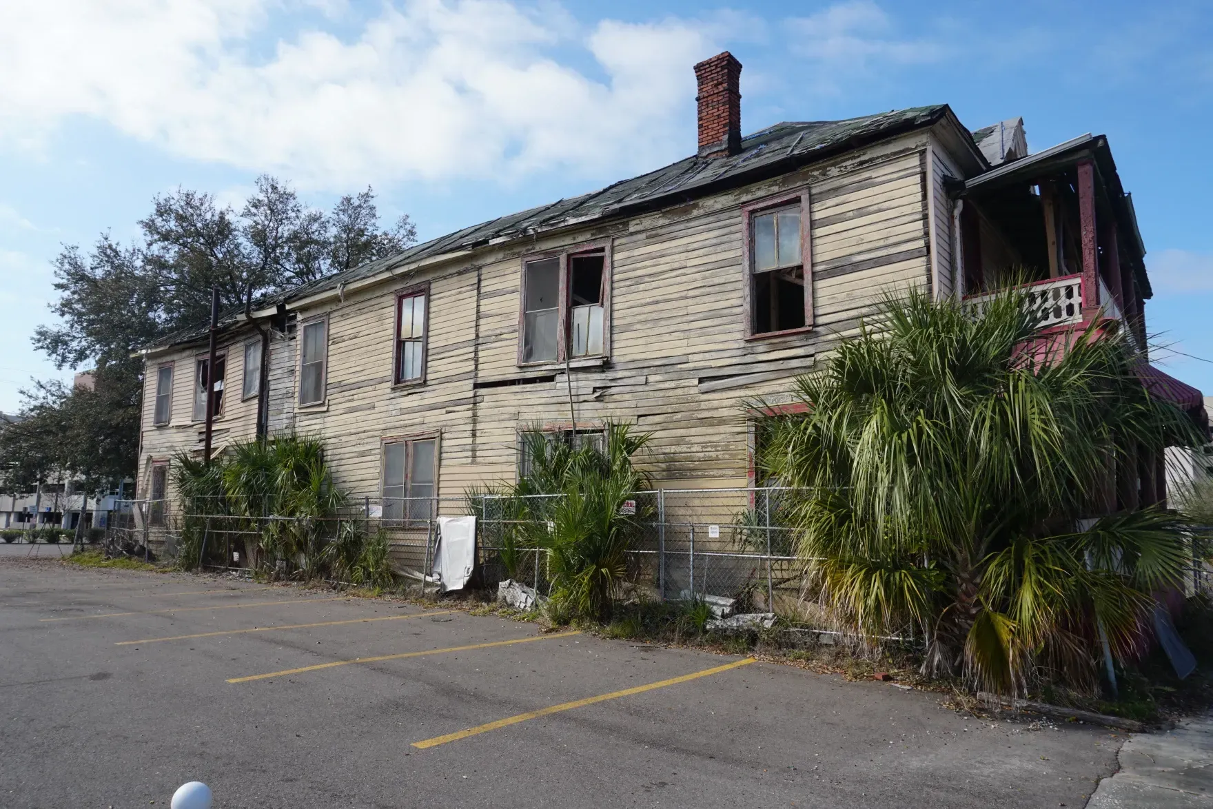 An old building with a lot of windows and a chimney