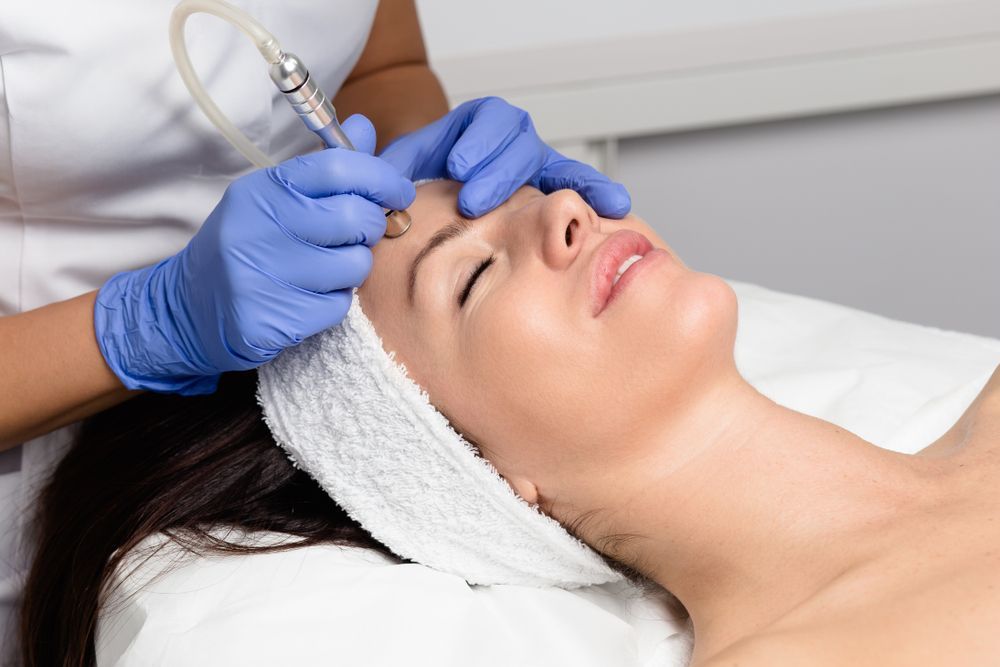 Woman Receiving Microdermabrasion Treatment — Bombshell Body Bar In Meikleville Hill, QLD
