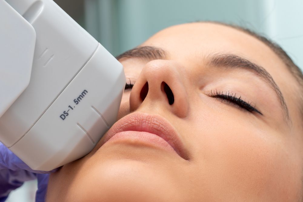 Woman's Face Close-up, Receiving a Cosmetic Ultrasound Treatment — Bombshell Body Bar In Meikleville Hill, QLD