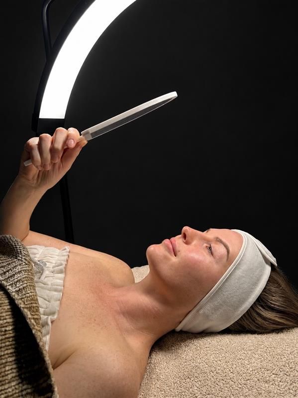 Woman Getting Eyelash Extensions at a Salon — Bombshell Body Bar In Meikleville Hill, QLD