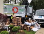 Boxes of paper to shred being loaded into truck