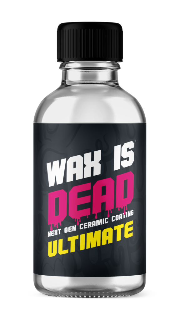 Bottle label reading “WAX IS DEAD ULTIMATE” in black, pink, and yellow on a clear bottle