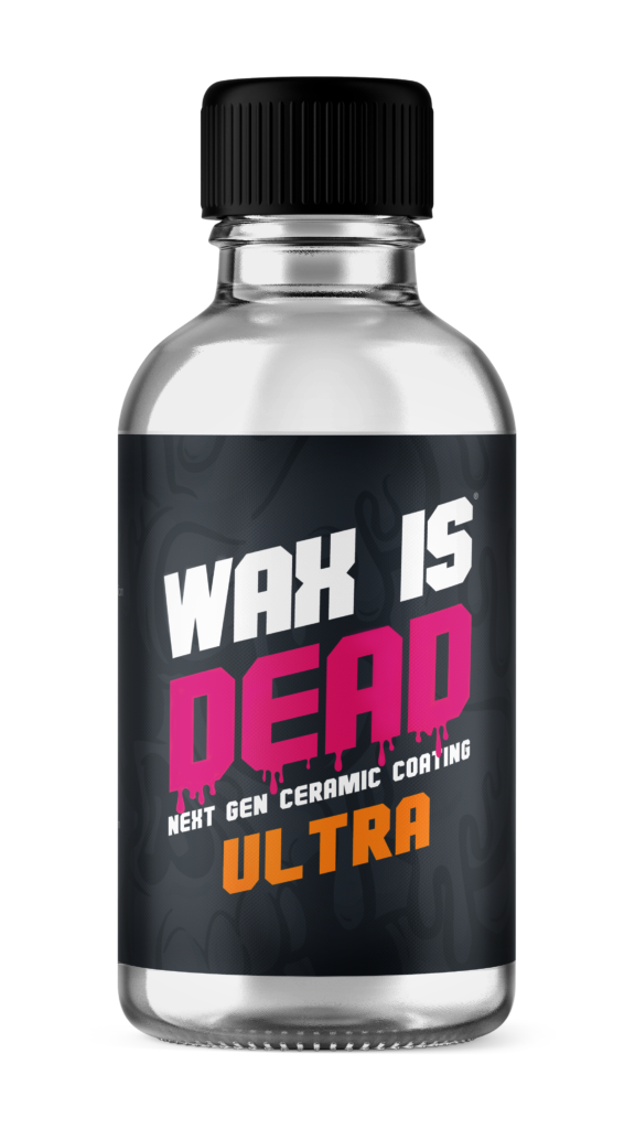 Bottle labeled “WAX IS DEAD ULTRA” with black cap and black, pink, and orange text.
