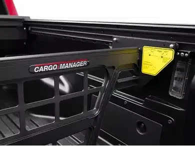 A close up of a cargo manager in a truck bed.