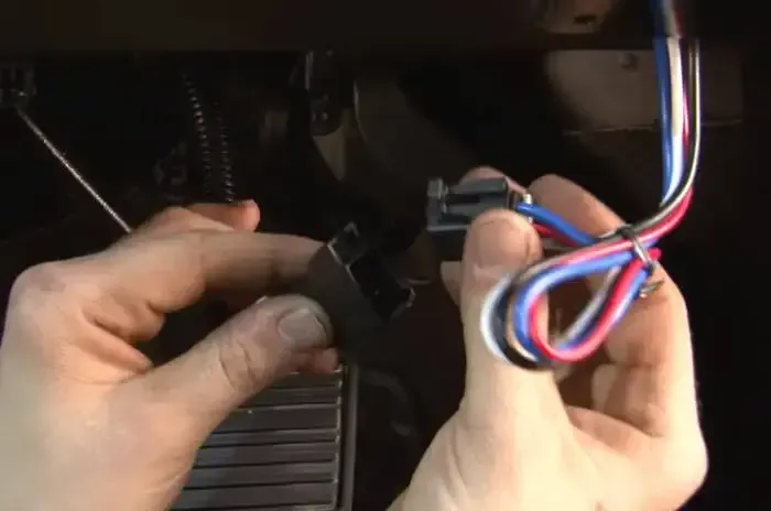 A person is holding a bunch of wires in their hands