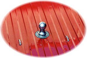 A metal ball is sitting on top of a red roof.