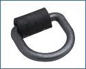 A close up of a black metal ring with a rubber pad on a white background.