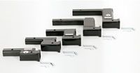 A group of black pieces of metal sitting on top of each other on a white surface.