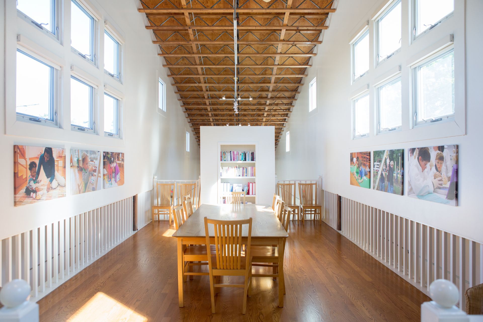 A large Montessori room with a table and chairs in it