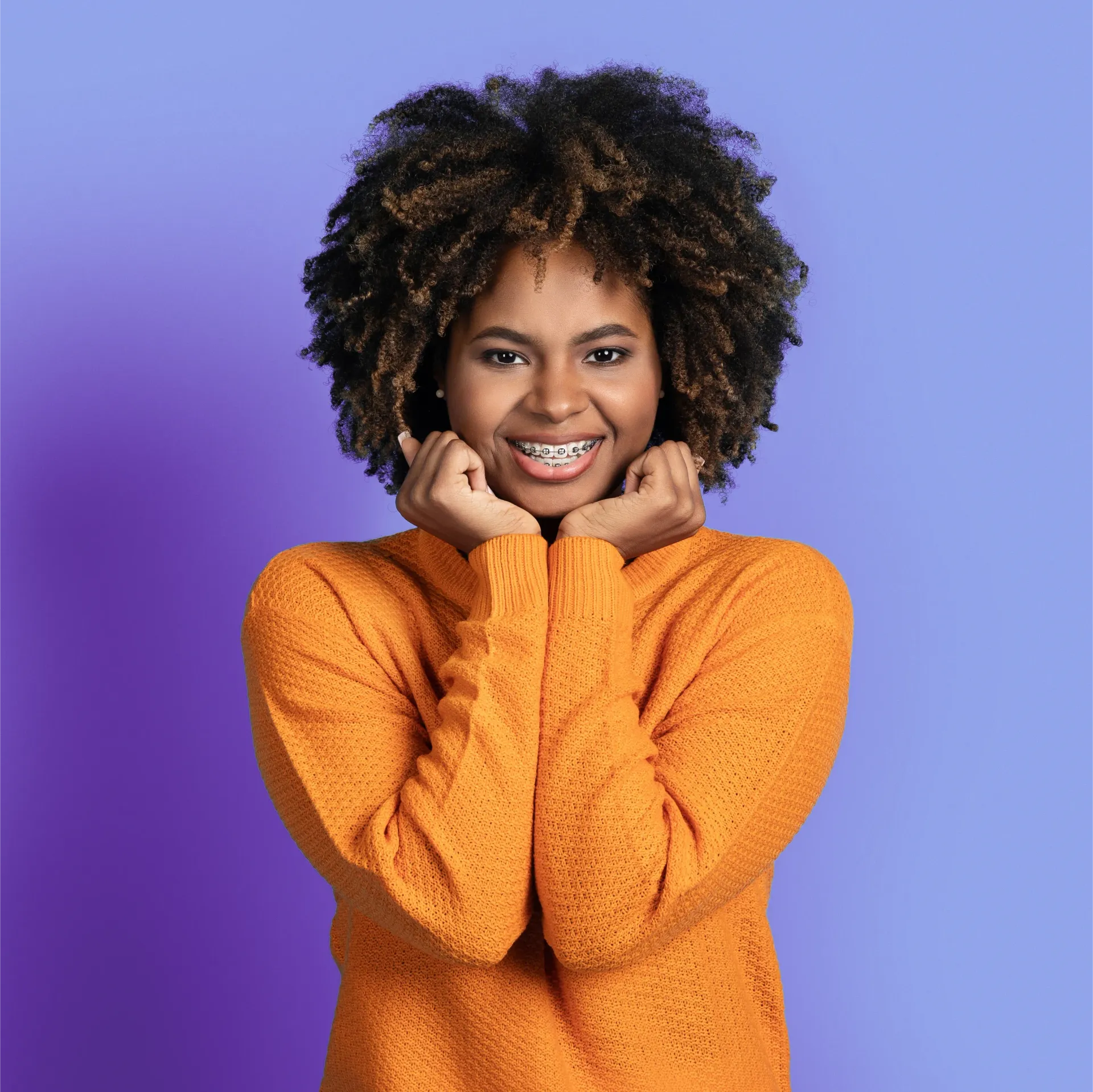 teenage girl with her eye closed, smiling