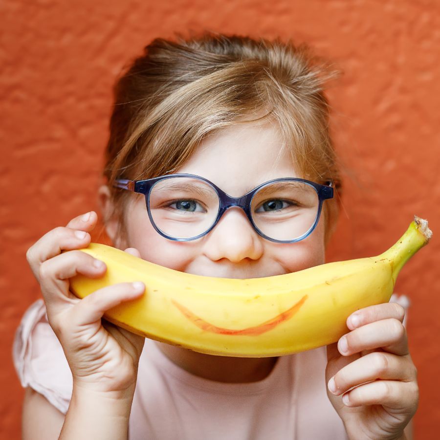 teenage girl with her eye closed, smiling