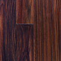 Close-up of dark brown wood grain with a small rectangular notch near the center
