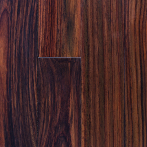 Close-up of dark brown wood grain with a small rectangular notch near the center