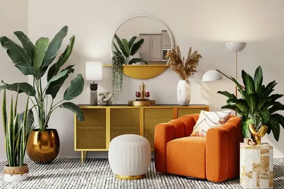 Stylish living room with orange chair, gold sideboard, and several green houseplants.