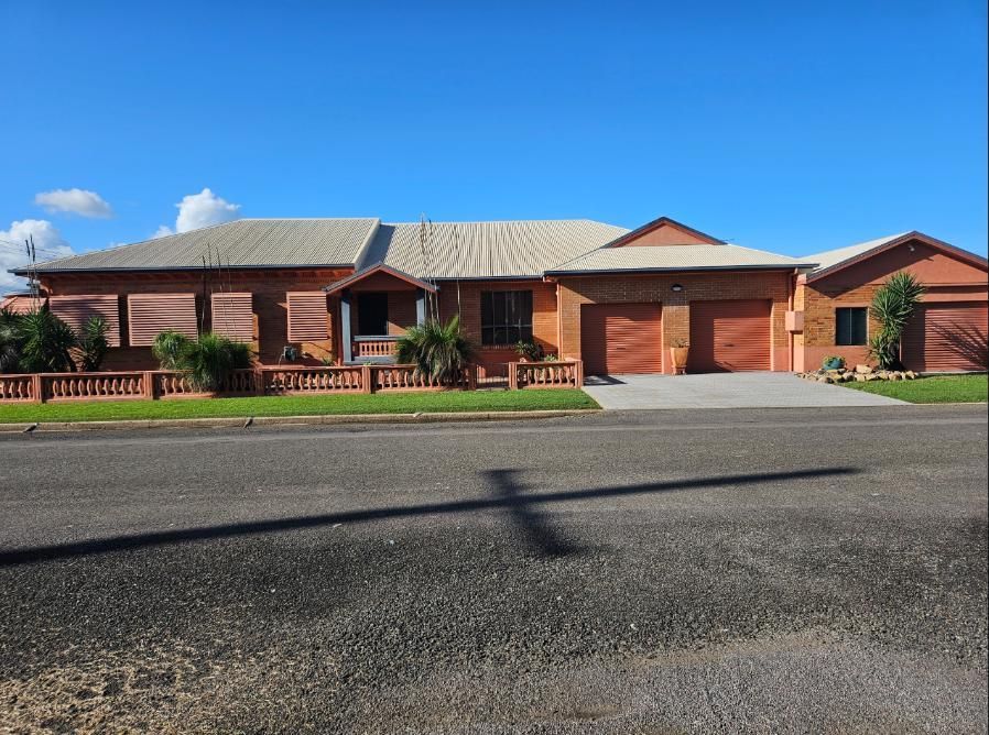 A Large House With a Shadow of a Cross on the Road — DJ's Pressure Cleaning In Carruchan, QLD