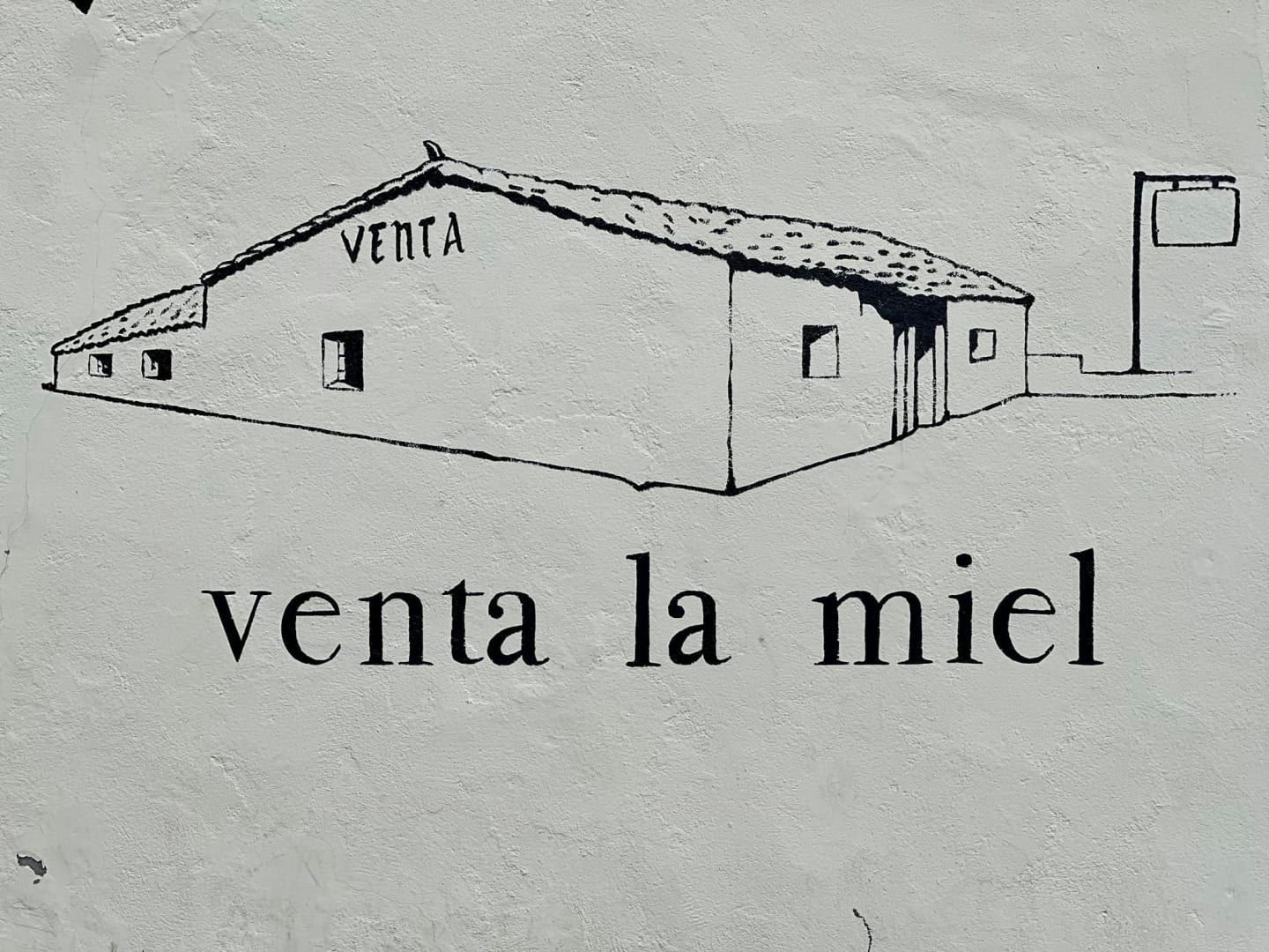 Sketch of a building labeled “venta la miel” with “VENTA” on the roof.