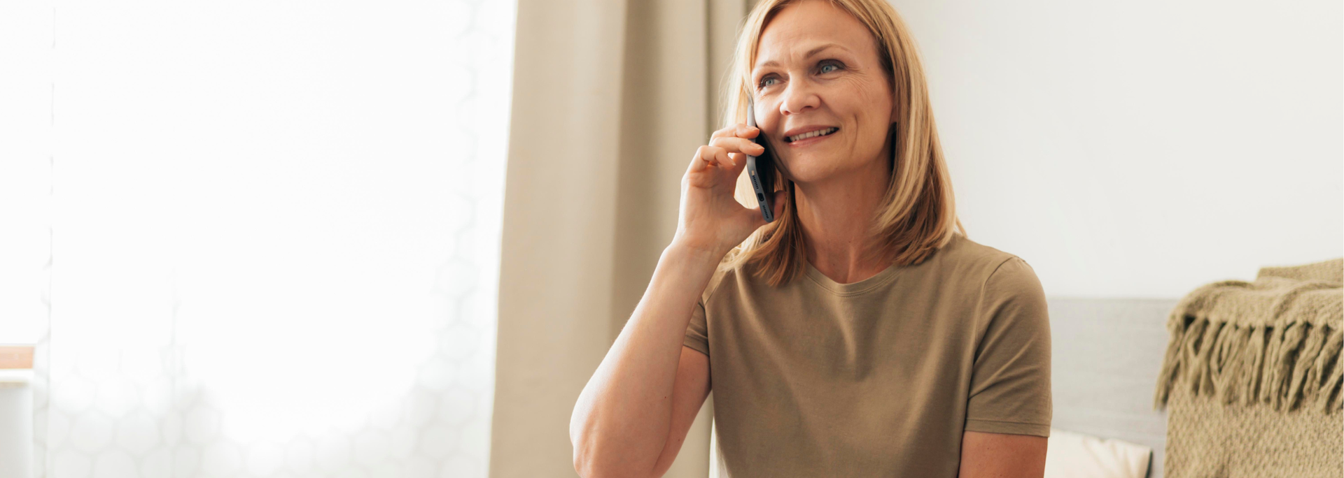 Picture of someone on the phone looking happy. Picture of someone on the phone looking happy.