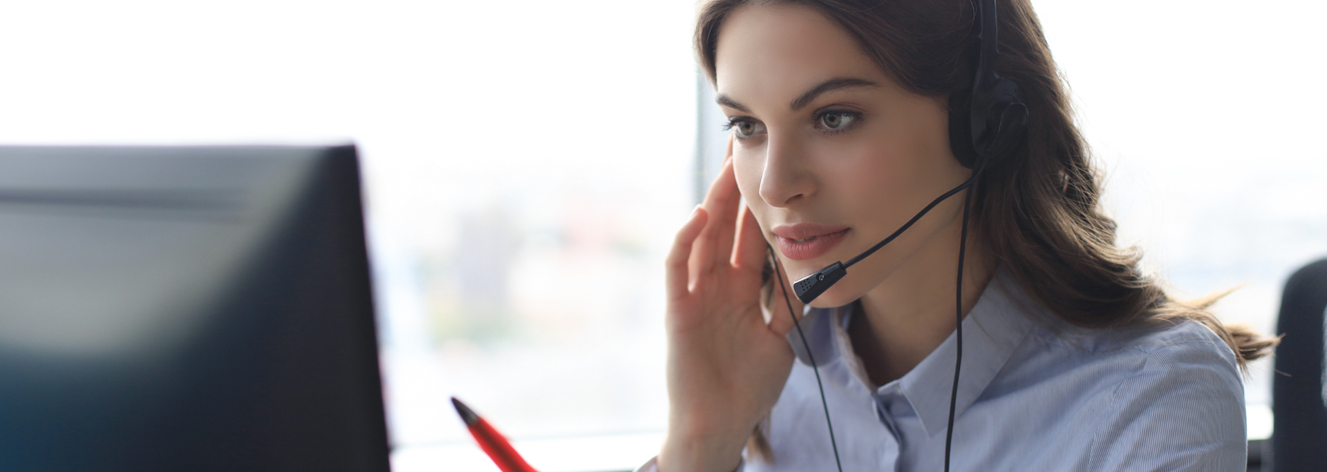 Picture of a person wearing a headset. Picture of a person wearing a headset.