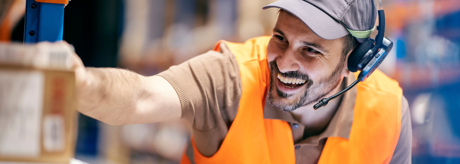 Picture of a warehouse worker with a headset. Picture of a warehouse worker with a headset.