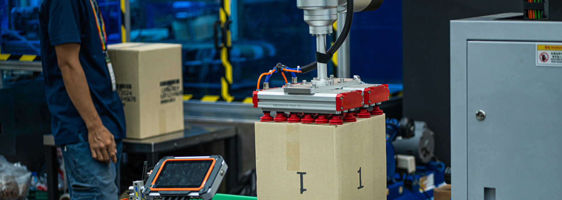 Picture of a robotic arm with suction grabbers. Picture of a robotic arm with suction grabbers.