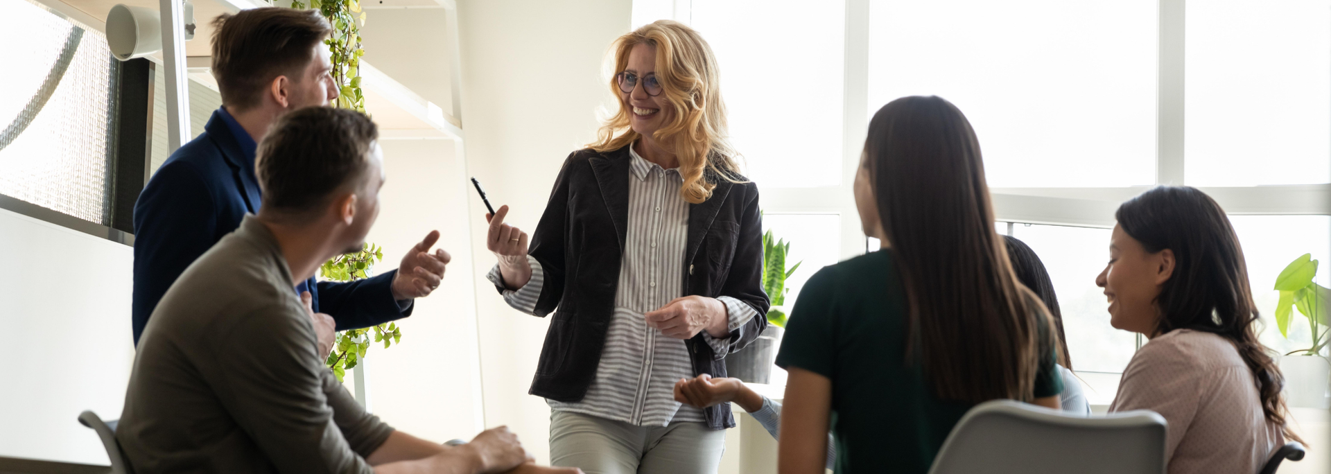 Picture of someone talking to their staff. Picture of someone talking to their staff.