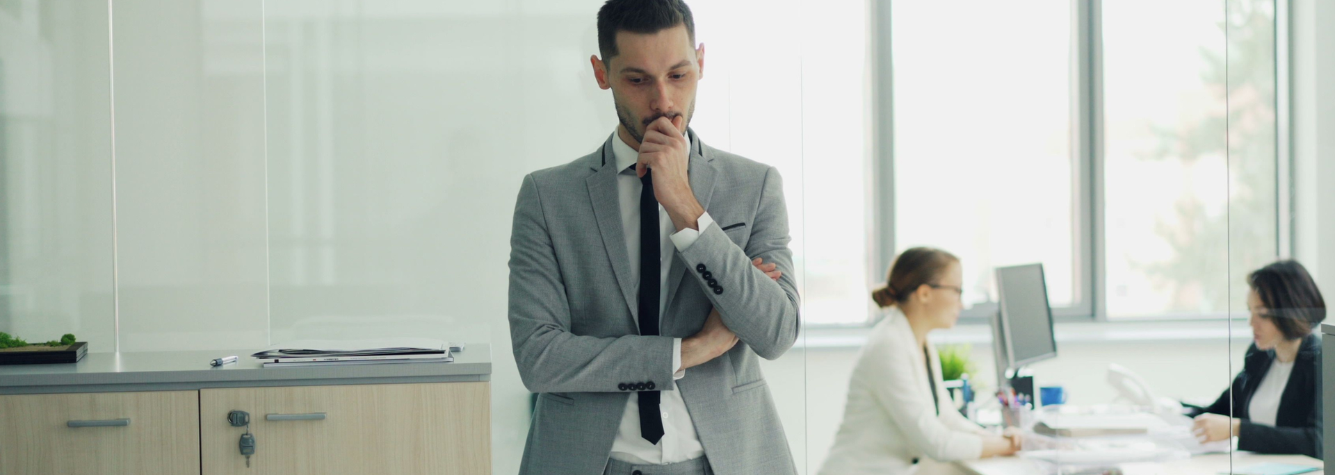 Picture of a business person thinking. 
