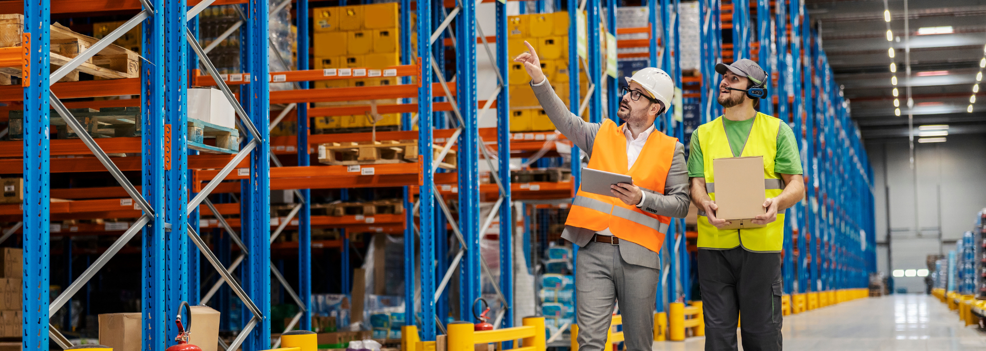 Picture of a manager showing a worker correct locations. Picture of a manager showing a worker correct locations.