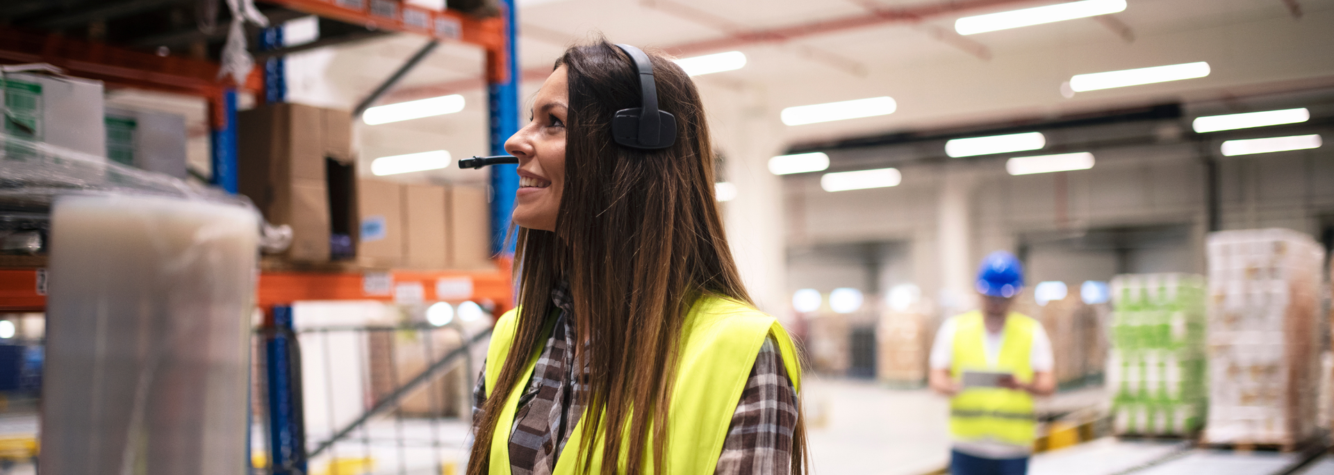Picture of a woman working in a warehouse. Picture of a woman working in a warehouse.
