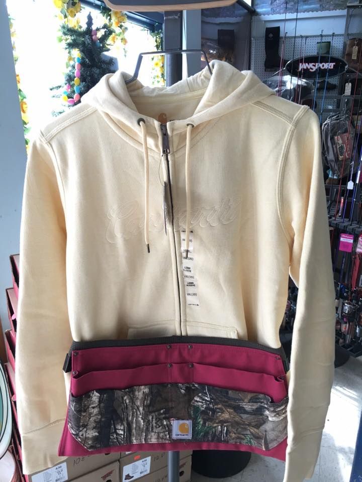 A white hoodie is on display in a store