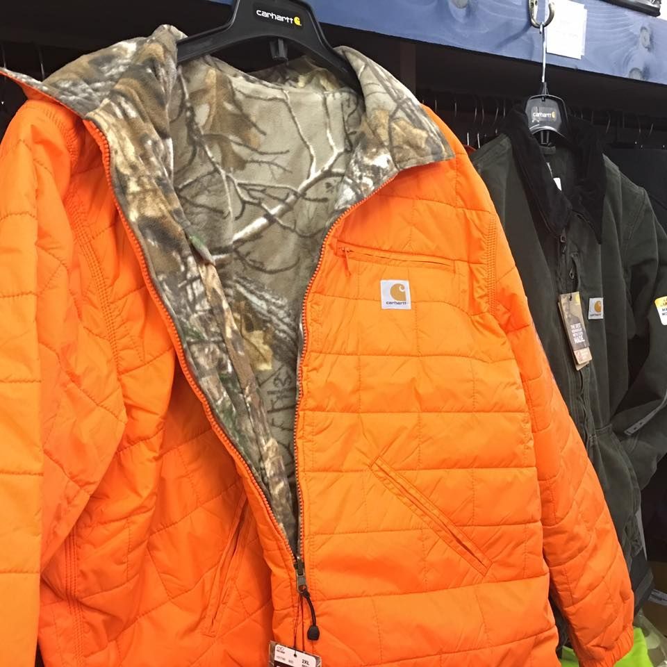 An orange jacket is hanging on a hanger