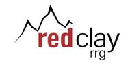A red clay logo with a mountain in the background.