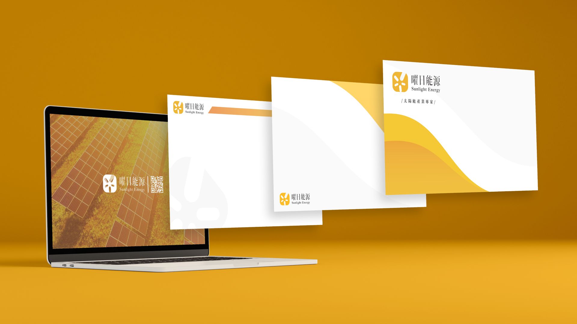一台筆記型電腦位於黃色背景的三個信封旁。