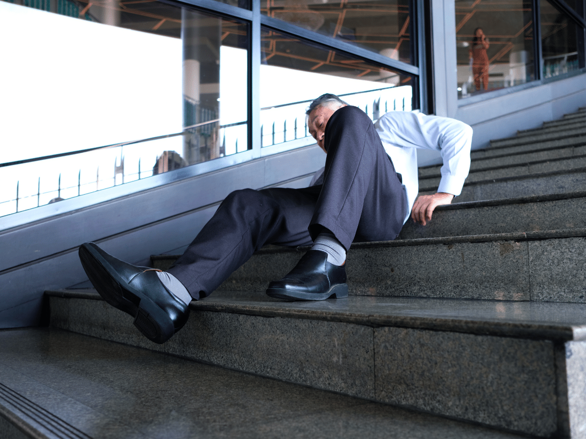 Man slipping down stairs.