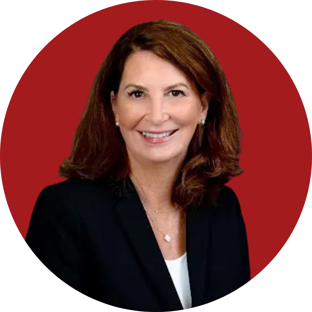 Smiling woman with shoulder-length brown hair on a red circular background