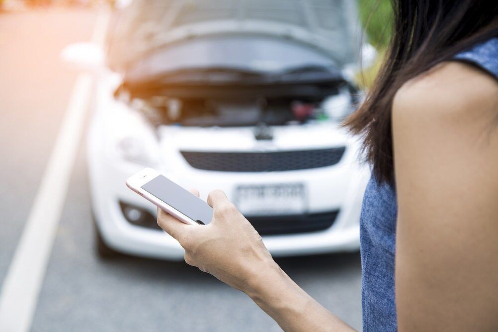 Frustrated Car Owner On Mobile Phone — A-Lect Auto Electrical & Air Conditioning In Garbutt QLD