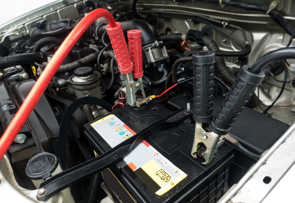 Selective Focus Charging Car Battery — A-Lect Auto Electrical & Air Conditioning In Garbutt QLD