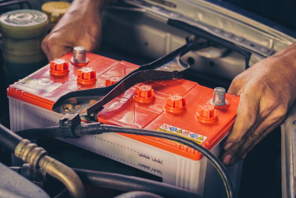 Car Mechanic Replace A Battery — A-Lect Auto Electrical & Air Conditioning In Garbutt QLD